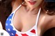 A woman in a bikini with an american flag on it.