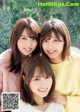 A group of three young women posing for a picture.